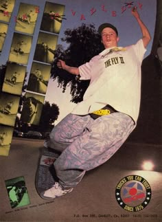 a man riding a skateboard down the side of a ramp with his arms in the air