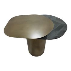 two round tables with metal bases on each side, one black and the other gold