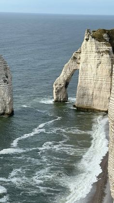 two large rocks sticking out of the ocean