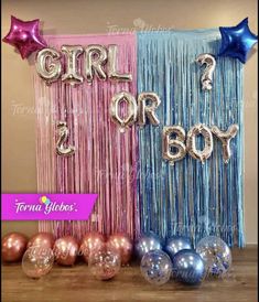 some balloons and streamers with the words girl or boy on them in pink, blue and silver