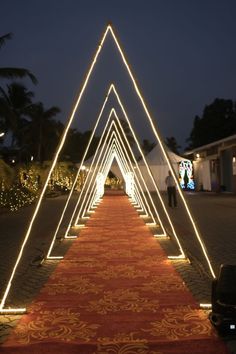 a long red carpet with white lights on it