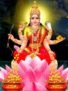 the hindu goddess sitting on top of a lotus flower with her hands in each other's pockets