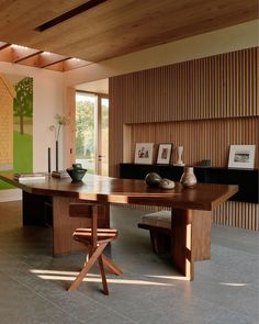 a large wooden table sitting in the middle of a room