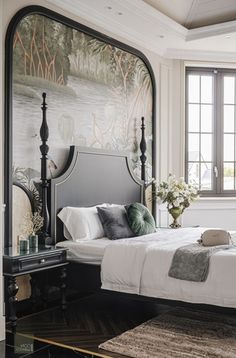 a bedroom with a bed, dresser and mirror in it's centerpieces