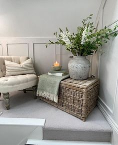 a living room filled with furniture and flowers