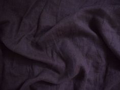 the fabric is very dark purple in color