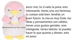 a pink stuffed penguin holding a white object in it's arms with spanish text