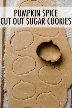 pumpkin spice cut out sugar cookies on a cookie sheet with text overlay that reads, pumpkin spice cut out sugar cookies