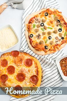 two homemade pizzas are sitting on a table next to bowls of rice and seasonings