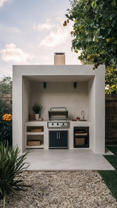 an outdoor kitchen is built into the side of a house