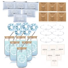 a set of four blue mason jars filled with wedding favors and place cards for the bride