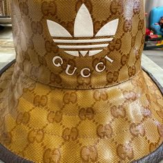 Selling This Unused Gucci X Adidas Bucket Hat Gucci Adjustable Bucket Hat, Gucci Brown Short Brim Hat, Gucci Adjustable Brimmed Hat, Gucci Brown Curved Brim Hat, Gucci Designer Wide Brim Hat, Trendy Gucci Hat With Short Brim, Gucci Luxury Brimmed Hat, Luxury Gucci Brimmed Hat, Luxury Gucci Hat