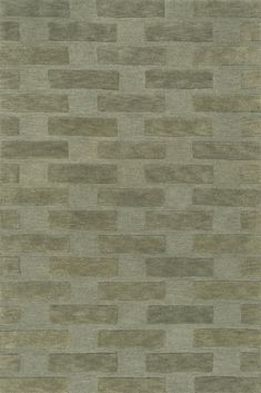 an area rug with squares and rectangles in grey, beige and brown colors