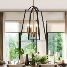 a chandelier hanging over a dining room table