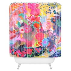 a colorful shower curtain with flowers and leaves on the outside, against a white background