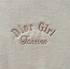 the embroidered logo on a white shirt that says,'dior girl forever '