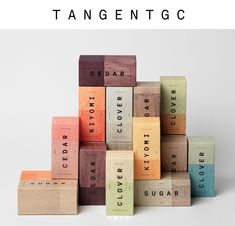 a stack of wooden blocks with the words cedar and sugar written on them in different colors