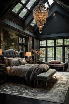 a bedroom with a large bed and chandelier hanging from it's ceiling