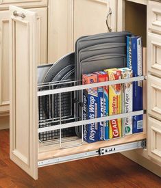 an open dish rack in the middle of a kitchen