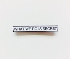 what we do is secret sticker on a white surface