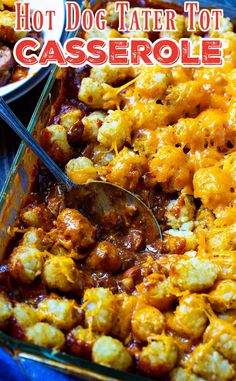 hot dog tater tot casserole in a blue dish with a spoon