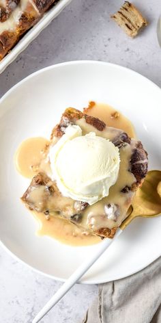 a white plate topped with dessert next to a bowl of ice cream and crackers