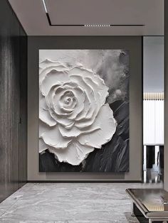 a large white rose on a black and white background in an elegant living room setting