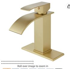 a gold faucet with the measurements for it