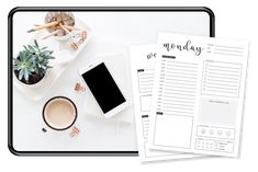 a white desk topped with a phone and coffee