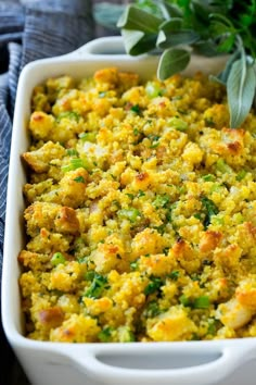 a casserole dish filled with stuffing and vegetables