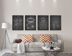 a living room filled with furniture and paintings on the wall above it's coffee table