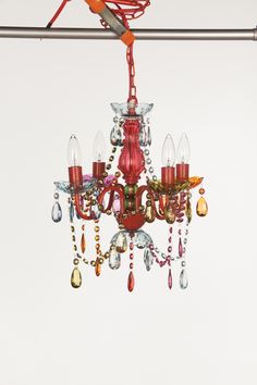 a red chandelier hanging from a ceiling