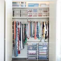 an organized closet with clothes and other items