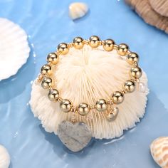 Embrace the natural beauty of summer with our unique Natural Stone Heart Bracelet with Pearl. This vintage-inspired charm will elevate your fashion and style, adding a special touch to any outfit. The 18k Gold on Brass also ensures the long-lasting color retention. The natural stones and glimmering pearl guarantee a shinning look that will make you stand out on any occasion. Don't miss out on this popular and timeless accessory! DETAILS Plating: 18k Gold Materials: 18k Gold on Brass, Natural Sto Trendy Gold Bracelets With Natural Stones, Casual Gold Beaded Charm Bracelet, Gold Casual Bracelets For Valentine's Day, Casual Gold Bracelets For Valentine's Day, Trendy Gold Beaded Heart Bracelet, Summer Heart-shaped Gold Jewelry, Bohemian Gold Bracelets With Heart Beads, Gold Bohemian Bracelet With Heart Beads, Gold Heart-shaped Casual Bracelet