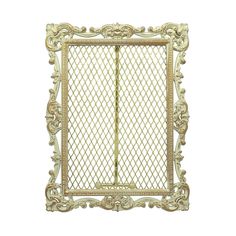 an ornate gold frame with intricate carvings on the edges and sides, set against a white background