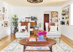 a living room with two chairs and a coffee table