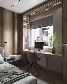 a bedroom with a bed, desk and chair in it next to a large window