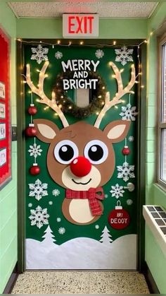 a door decorated with christmas lights and reindeer head on it's side, in front of a green wall