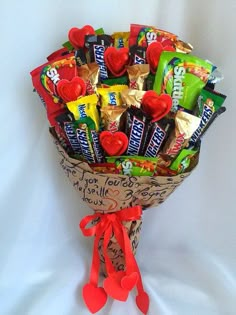 a bouquet of candy and candies on a white background