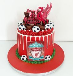 a soccer themed birthday cake on a red plate