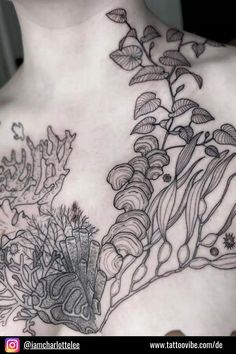 the back of a woman's chest with flowers and leaves