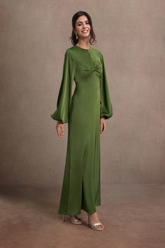 Be the center of attention in our Garcelle Maxi Dress. This beautiful stretch satin design combines a high neckline, balloon sleeves, twisted-front detailing and open back to create an enchanting statement at your next soiree. Green Mother Of The Bride Dresses, Green Dress Formal, Olive Green Maxi Dress, Atelier Dress, Satin Design, Green Long Sleeve Dress, Green Maxi Dress, Green Maxi, Maxi Dress Green