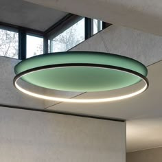 a circular light fixture hanging from the ceiling