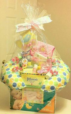 a basket filled with baby items sitting on top of a table