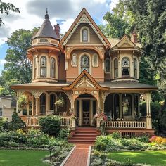 an old victorian style house with many windows