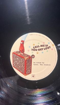 a record with an image of a red bird sitting on it's side and the words, all me if you get lost