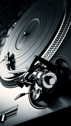 an old record player sitting on top of a table