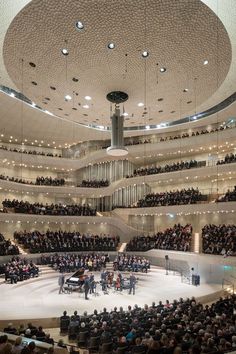 an auditorium filled with people and musical instruments