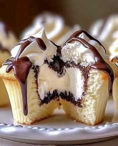 cupcakes with chocolate and white frosting on a plate