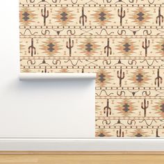 the wall paper is designed to look like an old southwestern style pattern with cactus and arrows on it